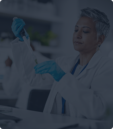 Scientist examining a test tube in a laboratory.